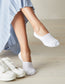 Woman wearing Simon de Winter Women's Cushion Foot No Show Socks in White under sneakers