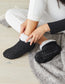 Woman wearing Simon de Winter Women's Chunky Knit Socks in Black