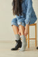 Woman wearing Simon de Winter Women's Slouch Socks in Grey with boots